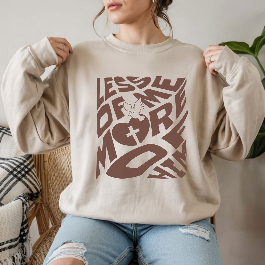 Cozy Unisex Heavy Blend™ Crewneck Sweatshirt featuring a 'Less of Me, More of Him' religious quote