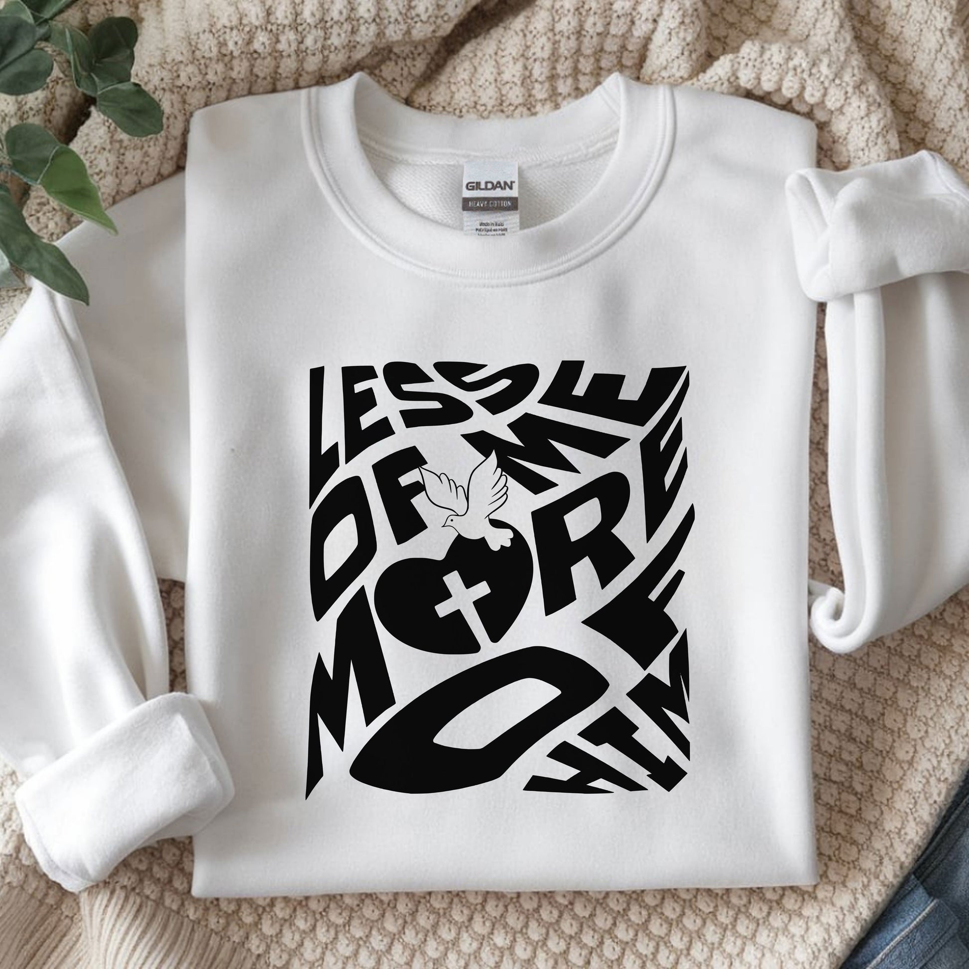 Cozy Unisex Heavy Blend™ Crewneck Sweatshirt featuring a 'Less of Me, More of Him' religious quote